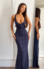 Navy lace maxi dress featuring a deep V-neckline, ruched detailing at the waist, and a fitted silhouette