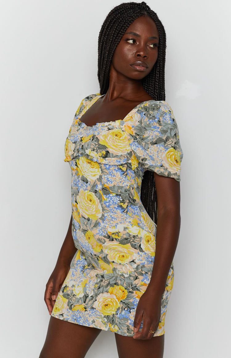 Yellow, blue, and grey floral mini dress with sweetheart neckline, short puff sleeves, and ruched bodice