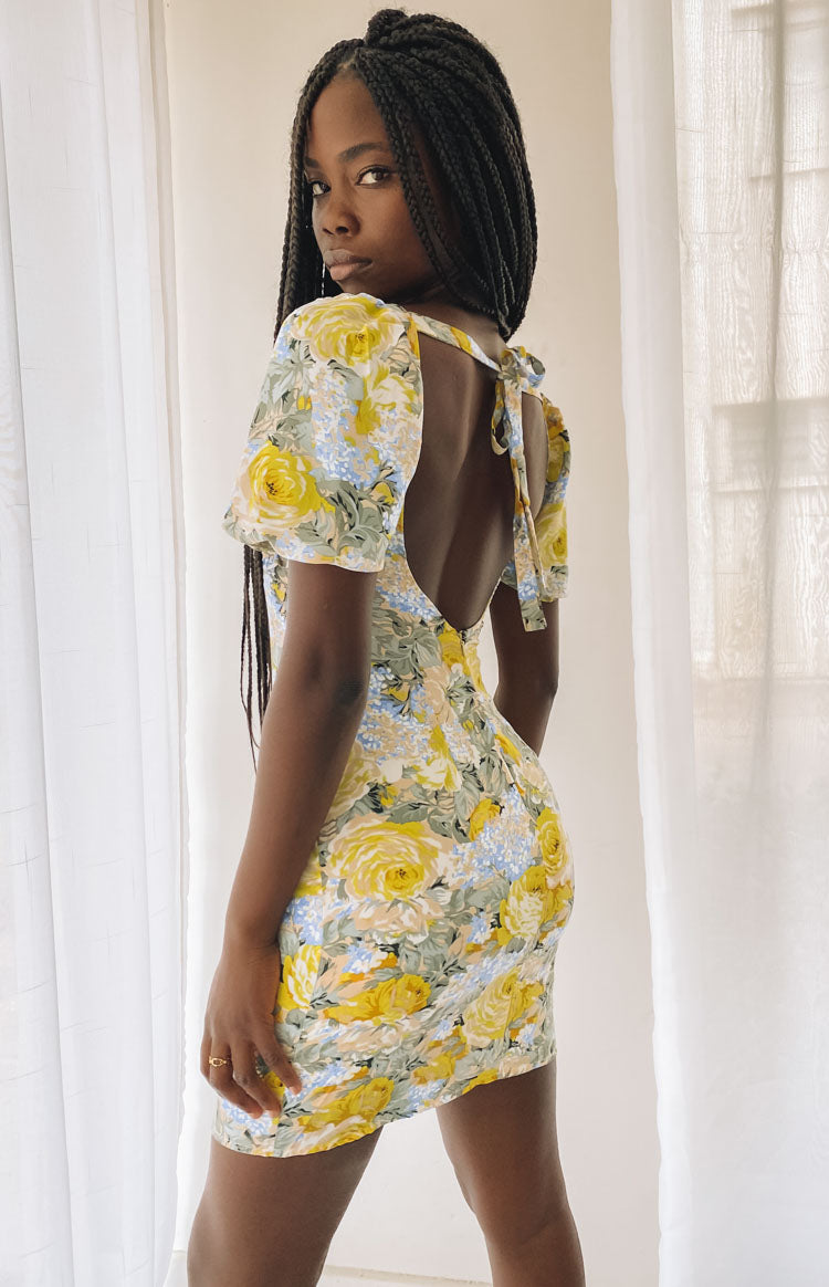Yellow and blue floral mini dress with sweetheart neckline, short puff sleeves, and ruched bust detail