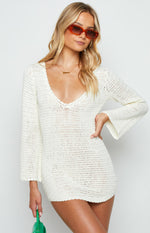 White crochet knit mini dress with a scalloped deep V-neckline and long bell sleeves