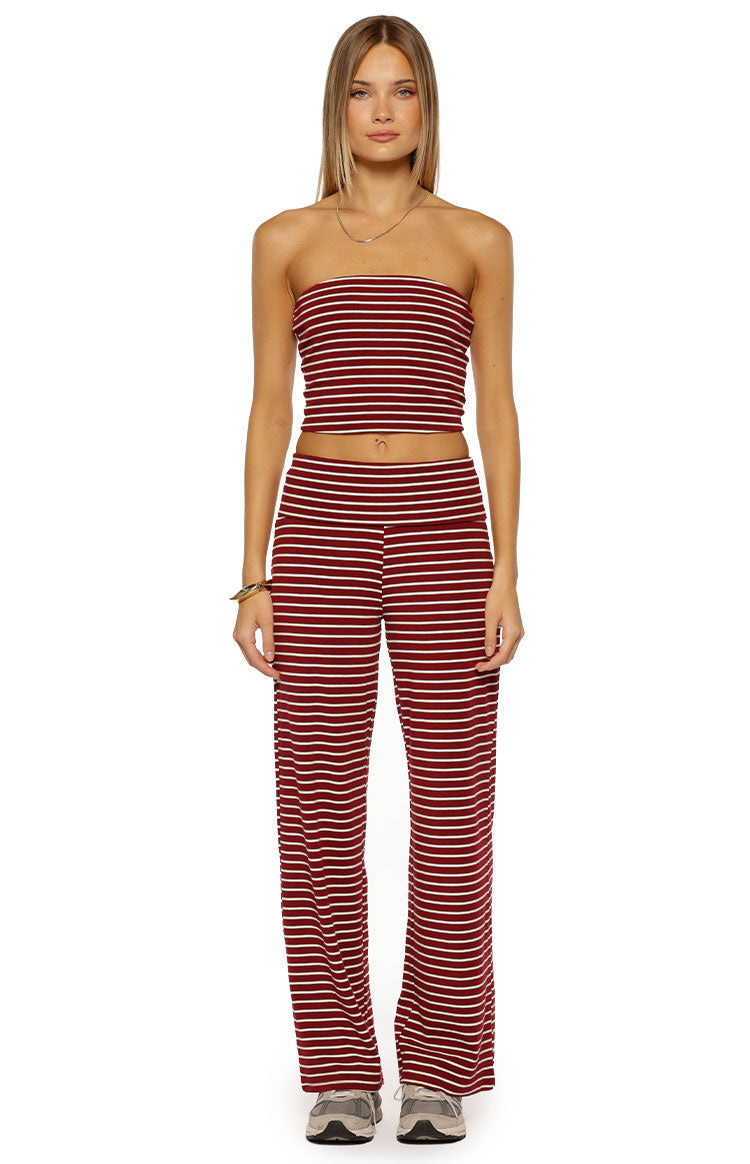 Front view of a burgundy and white striped strapless tube top, cropped at the midriff