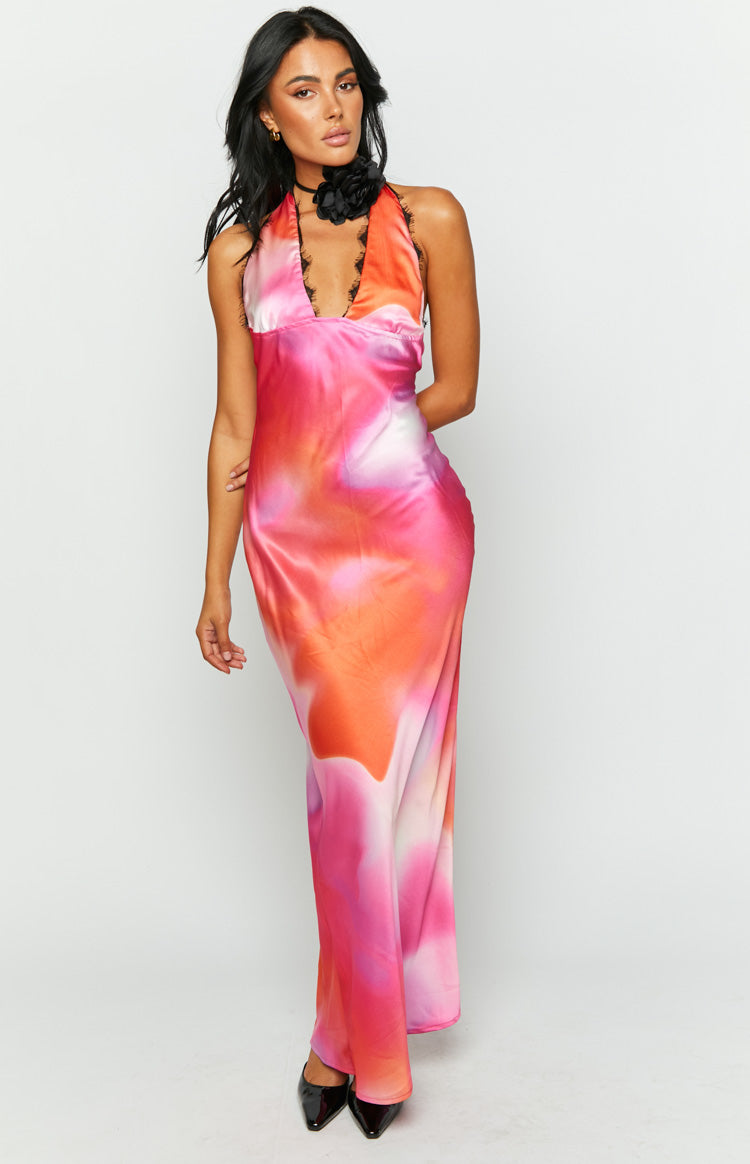 Full length front view of a pink, orange, and white tie-dye satin maxi dress with a halter neckline and black lace
