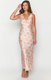 Full length front view of a light floral paisley maxi dress with a V-neckline and fitted ruched bodice