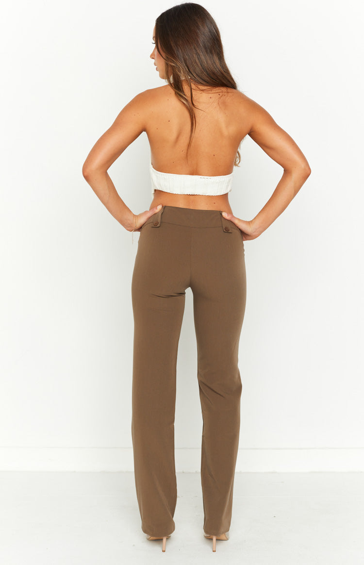 Rear view of taupe low waist pants with a straight leg and two decorative buttons on the back of the waistband