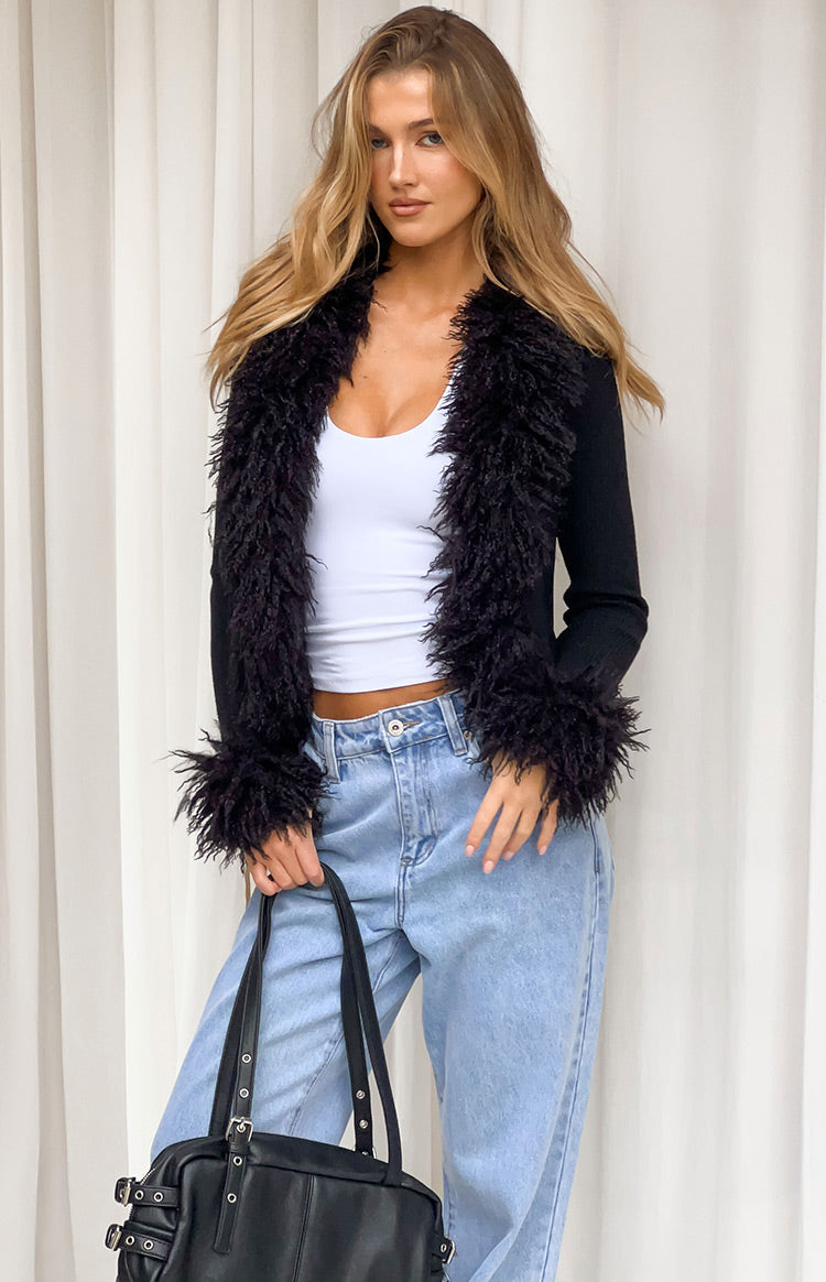 Black knit cardigan with shaggy fur trim on the open front and cuffs, cropped fit