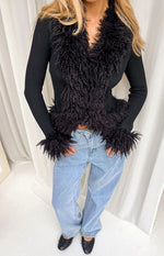 Black knit cardigan with fluffy fur trim on the V-neckline, cropped hem, and long sleeve cuffs