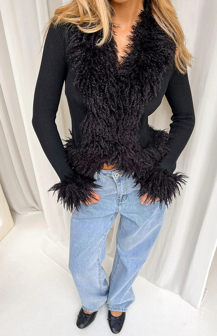 Black knit cardigan with fluffy fur trim on the V-neckline, cropped hem, and long sleeve cuffs