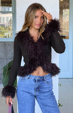 Chocolate ribbed knit cardigan with shaggy fur trim along the V-neckline and cuffs