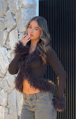 Chocolate ribbed knit cardigan with shaggy fur trim along the V-neckline, front opening, and cuffs