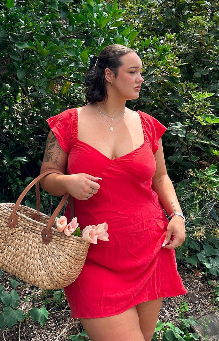 Beginning Boutique Waves Red Mini Dress red sweetheart neckline mini dress with ruffled cap sleeves and a flowy skirt