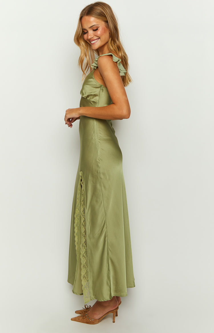 Side view of a sage satin maxi dress with ruffled shoulder straps and a lace-trimmed side slit