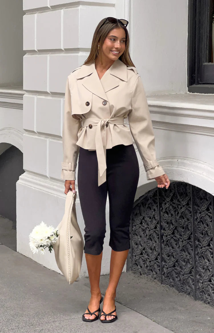 Beginning Boutique Wilda Cream Cropped Trench Coat cream double-breasted trench with wide lapels, shoulder epaulets, tie wais