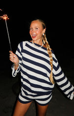 Navy and white striped off shoulder knit sweater with wide cuffs and matching knit shorts