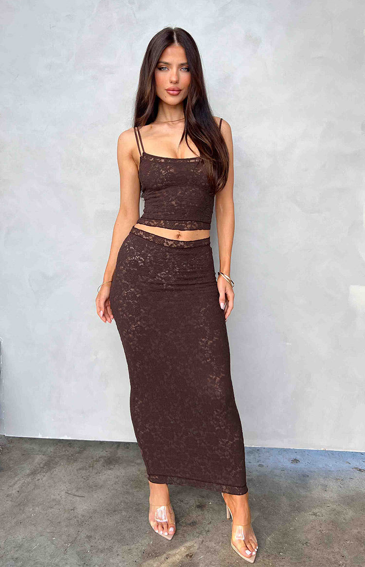 Front view of a fitted brown lace midi skirt with a delicate floral pattern