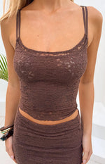 Close-up of a fitted brown floral lace tank top with double spaghetti straps, scoop neckline, and scalloped hem