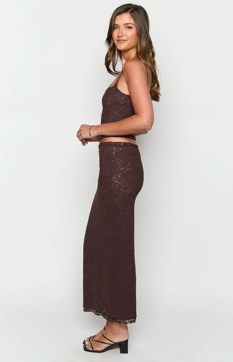 Side view of a brown lace midi skirt, showing its fitted silhouette and delicate scalloped hem
