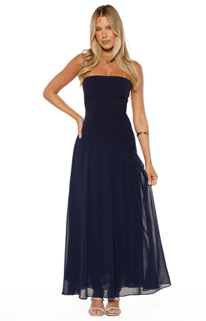 Beginning Boutique Zelia Strapless Navy Maxi Dress navy strapless fitted bodice with diagonal seam and flowy pleated chiffon maxi skirt