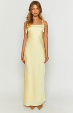 Front view of a yellow satin maxi dress with a square neckline, tie-shoulder straps, and a fitted bust band