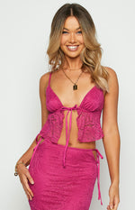 Close-up of the fuschia lace tie-up front top showing the delicate tie closure and intricate lace pattern