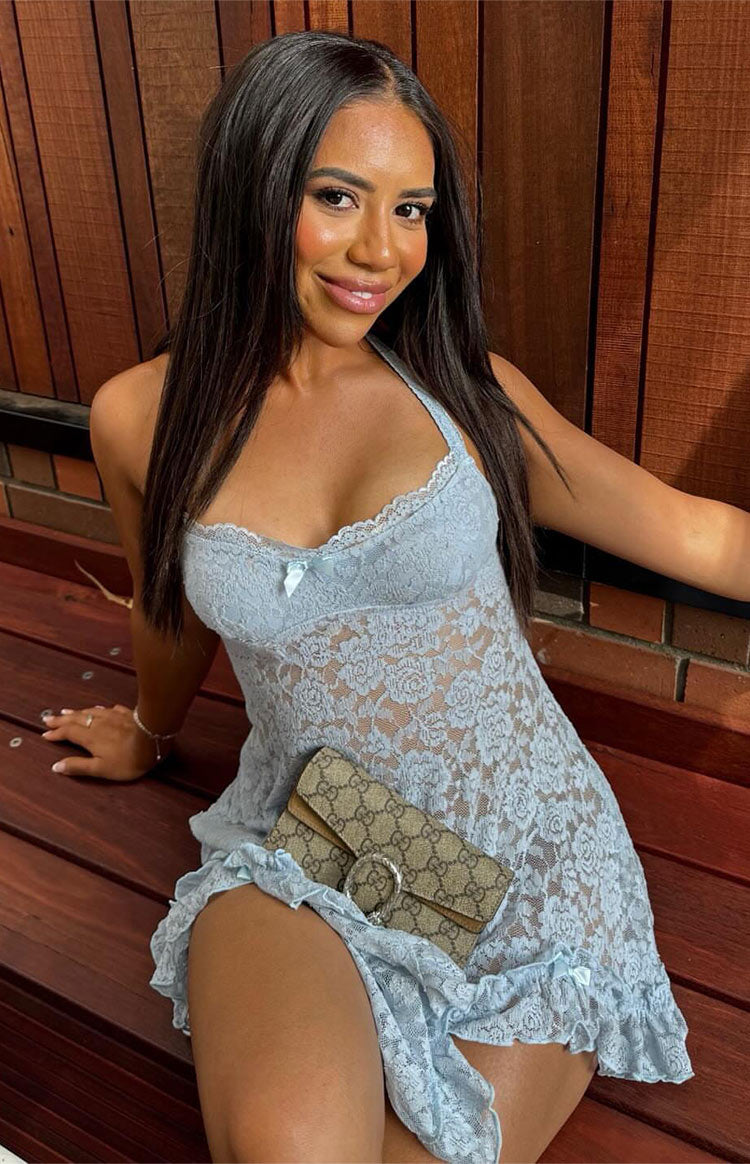 Light blue lace mini dress with a halter neckline, white lace trim, a small bow detail, and a ruffled hem