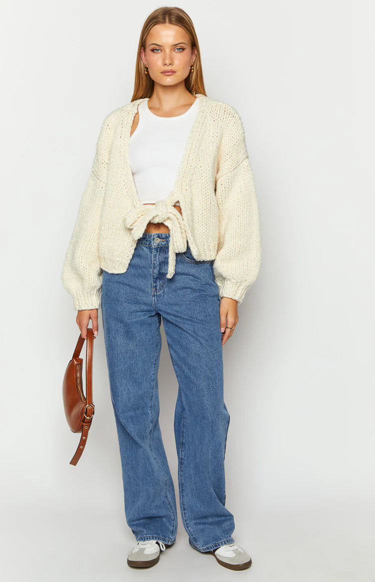 Cream chunky knit cardigan with a wide boat neck, dropped shoulders, and long balloon sleeves