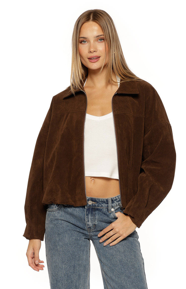 Front view of a brown suedette bomber jacket, unzipped, with a relaxed fit, collar, and elasticated hem