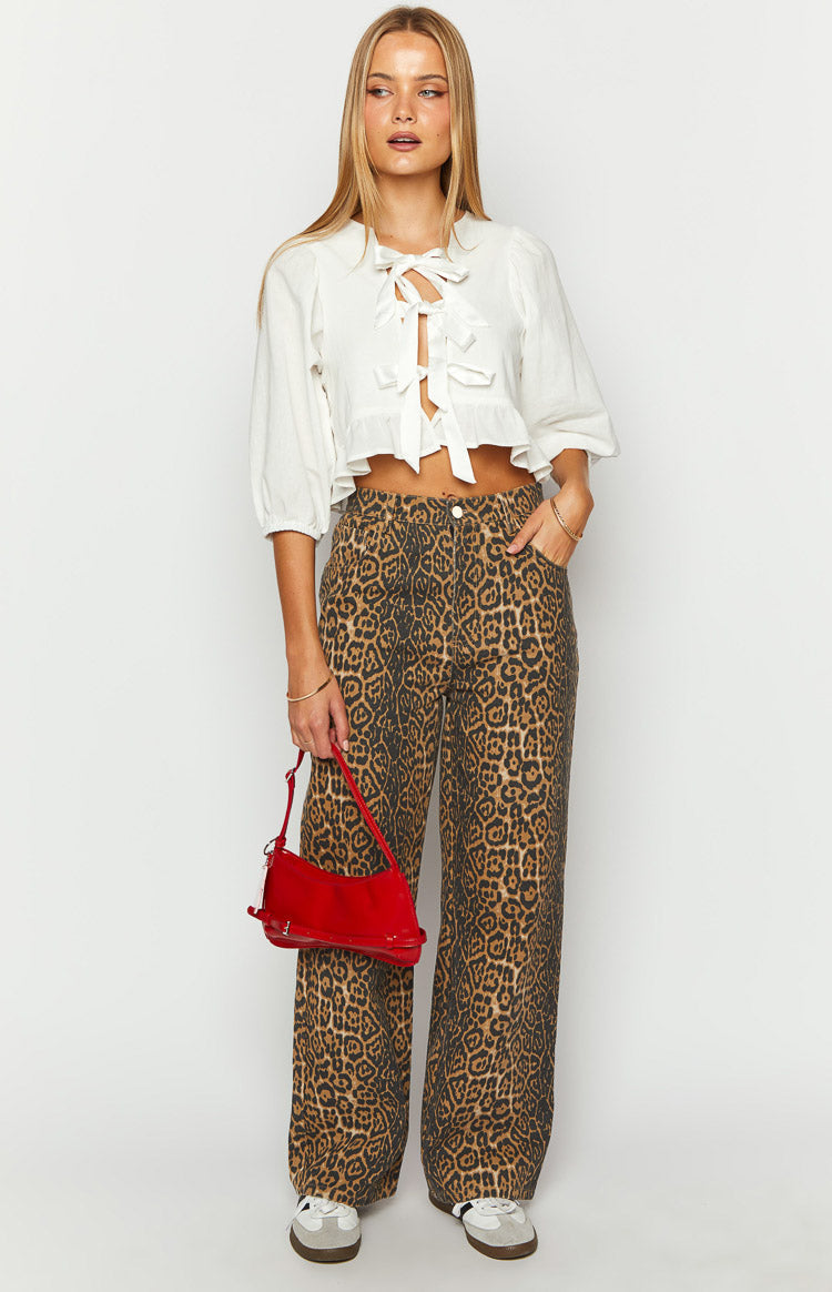 Full length view of brown and black leopard print straight leg jeans