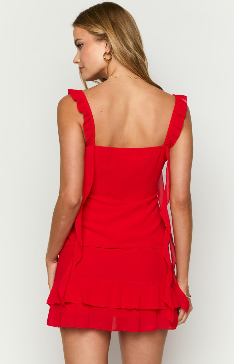 Rear view of a red chiffon top with a square back, ruffled shoulder straps, and long chiffon ties