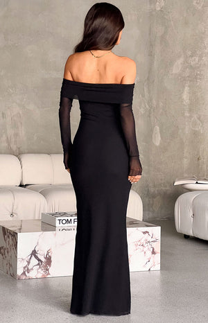 Rear view of the black off-shoulder maxi dress with a folded over neckline and sheer long sleeves