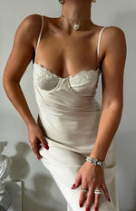 Close-up of the cream satin midi dress showing the delicate lace trim on the bust and thin straps