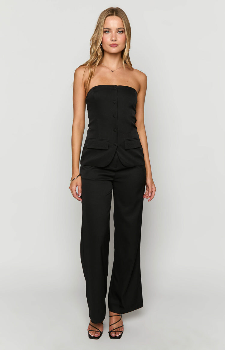 Full length view of a black strapless button-up top with flap pockets, paired with matching wide-leg pants