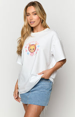 Front view of a white oversized tee with a round neck and a graphic print of a lion cub and 'duvet day' text