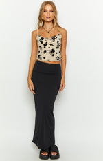 Beige mesh crop top with black velvet floral pattern, sweetheart neckline, thin spaghetti straps, and lettuce-edge hem