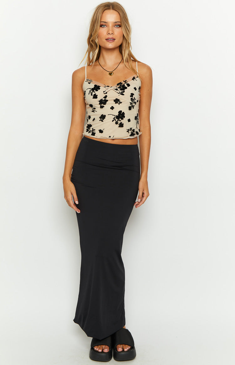 Beige mesh crop top with black velvet floral pattern, sweetheart neckline, thin spaghetti straps, and lettuce-edge hem