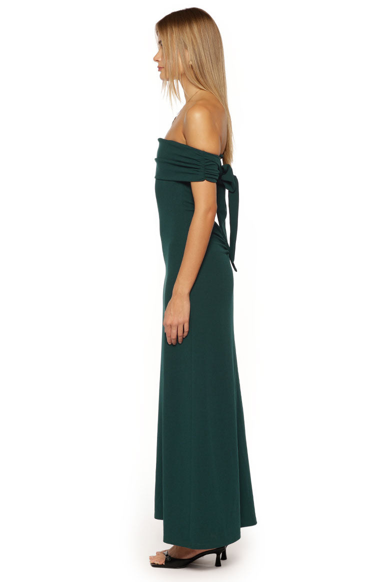 Side view of a teal crepe off-the-shoulder maxi dress with ruched sleeves and a tie detail at the shoulder