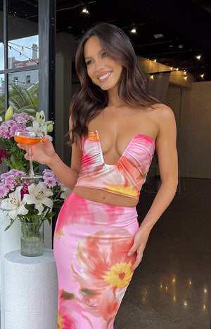 Beginning Boutique Esha Pink Floral Strapless Crop Top pink floral strapless crop top with a deep plunge V-neckline and ruched detail