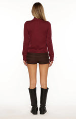 Burgundy zip up knit sweater with a full silver zipper and ribbed cuffs