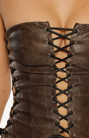 Close up of a brown faux leather strapless corset top with black lacing a sexy top for a Summer Festival