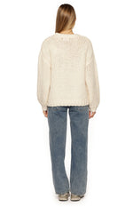 Rear view of a cream chunky knit sweater with a relaxed fit, dropped shoulders, and ribbed hem