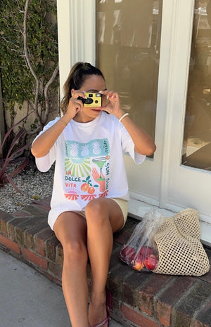 Beginning Boutique Jaz Dolce Vita Print Tee white oversized crew neck tee with a colourful fruit and cocktail graphic print