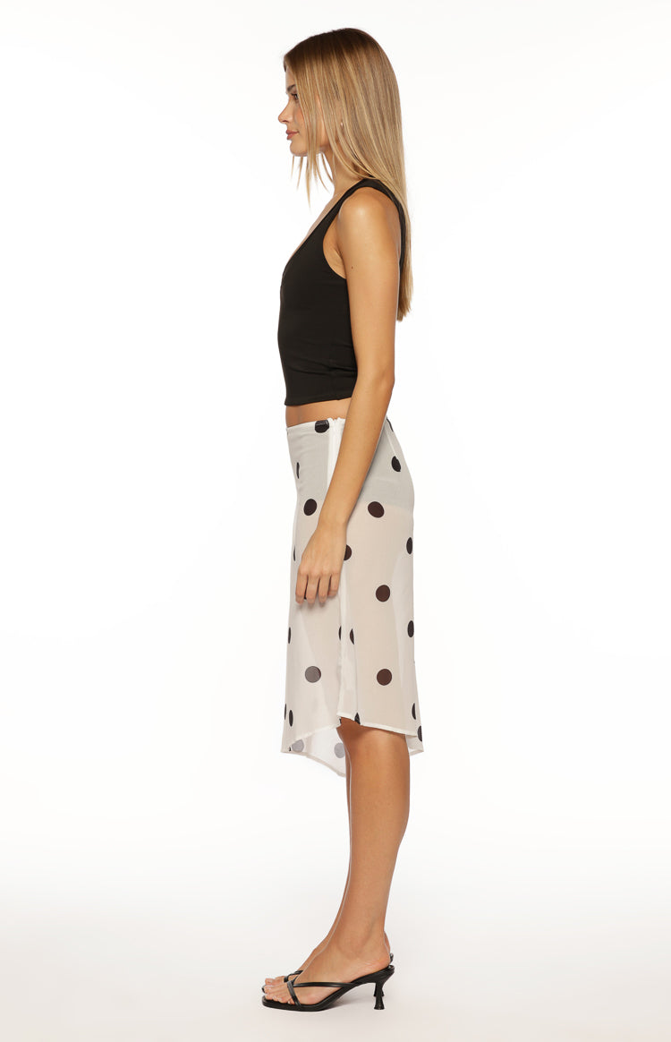 Side view of a black V-neck tank showing the fitted silhouette and sleeveless design