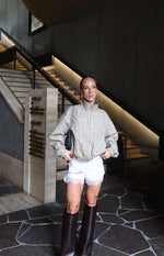 Beige plaid funnel neck jacket with a relaxed fit, voluminous sleeves, and elasticated blouson hem