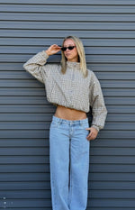 Cropped beige plaid funnel neck jacket with a relaxed fit, elasticated hem, and long sleeves with elasticated cuffs