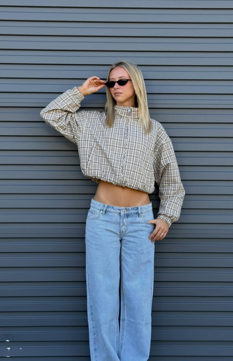 Cropped beige plaid funnel neck jacket with a relaxed fit, elasticated hem, and long sleeves with elasticated cuffs
