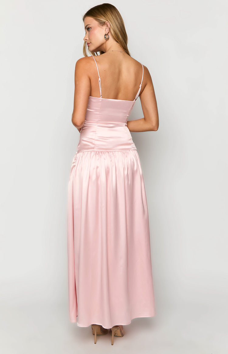 Back view of a pink satin maxi dress with thin spaghetti straps, a fitted bodice, and a gathered maxi skirt