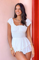Beginning Boutique Maisha White Playsuit white swiss dot square neck playsuit with smocked bodice and tiered ruffled shorts