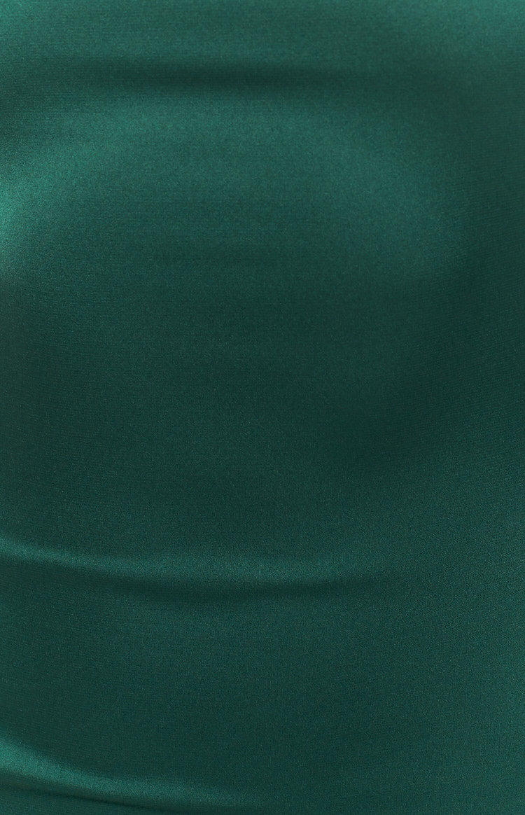 Emerald green fabric with a smooth, lustrous finish and gentle drapes