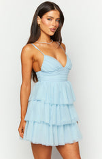 Side view of the light blue tulle mini dress with a ruched V-neck bodice, thin spaghetti straps, and tiered skirt