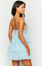 Side view of a blue tulle mini dress with a ruched bodice and tiered skirt
