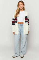 Cream cable knit cardigan with burgundy and navy striped long sleeves and front pockets